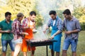 Happy friends enjoying barbecue party Royalty Free Stock Photo
