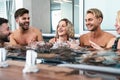 Happy friends enjoying vacations in jacuzzi luxury house - Young people having fun together in hot tub Royalty Free Stock Photo