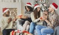 Happy friends exchanging Christmas presents Royalty Free Stock Photo