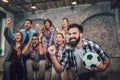 Happy friends or football fans watching soccer on tv and celebrating victory Royalty Free Stock Photo