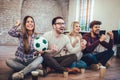 Happy friends or football fans watching soccer on tv and celebrating victory Royalty Free Stock Photo