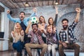 Happy friends or football fans watching soccer on tv and celebrating victory Royalty Free Stock Photo