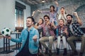 Happy friends or football fans watching soccer on tv and celebrating victory Royalty Free Stock Photo