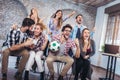 Happy friends or football fans watching soccer on tv Royalty Free Stock Photo