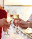 Happy friends with glasses of champagne on yacht. Vacation, travel, sea and friendship concept Royalty Free Stock Photo