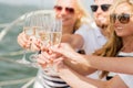 Happy friends with glasses of champagne on yacht Royalty Free Stock Photo