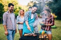 Happy friends enjoying barbecue party Royalty Free Stock Photo