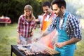 Happy friends enjoying barbecue party Royalty Free Stock Photo