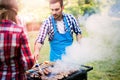 Happy friends enjoying barbecue party Royalty Free Stock Photo