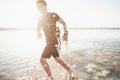 Happy friends have fun on the beach - Young people playing in open air water on summer holidays. Royalty Free Stock Photo