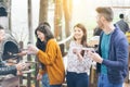 Happy friends having barbecue dinner in backyard - Young people drinking wine and eating bbq vegetables outdoor - Friendship, food Royalty Free Stock Photo