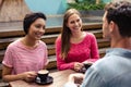 Happy friends having coffee together Royalty Free Stock Photo