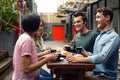 Happy friends having coffee together Royalty Free Stock Photo