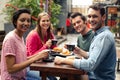 Happy friends having coffee together Royalty Free Stock Photo