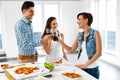 Happy Friends Having Dinner Party Home. Eating Food, Friendship. Royalty Free Stock Photo