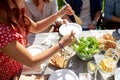Happy friends having dinner at summer party Royalty Free Stock Photo