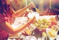 Happy friends having dinner at summer party Royalty Free Stock Photo