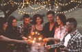 Happy friends having fun at bbq dinner with sparklers lights outdoor drinking wine - Young people celebrating on weekend summer Royalty Free Stock Photo
