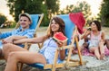 Happy friends having fun on the beach and eating watermelon. Royalty Free Stock Photo