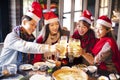 Happy friends having fun and celebrating christmas in hot pot Royalty Free Stock Photo