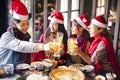 Friends having fun and celebrating christmas in hot pot restaurant Royalty Free Stock Photo