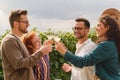 Happy friends having fun drinking wine at vineyard Royalty Free Stock Photo