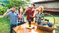 Happy friends having fun drinking at winery vineyard - Friendship concept with young people enjoying harvest together Royalty Free Stock Photo