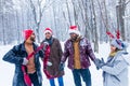 Happy friends is having fun and enjoying first snow wear fun hat and deer horn Royalty Free Stock Photo