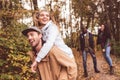 Happy friends having fun in forest Royalty Free Stock Photo