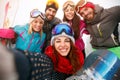 Happy friends having fun on snow. Snowbarders and skiers group t Royalty Free Stock Photo