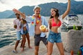 Happy friends having fun with tropical cocktails on beach party. Travel and summer vacation concept. Royalty Free Stock Photo