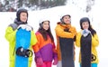 Happy friends in helmets with snowboards Royalty Free Stock Photo