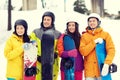 Happy friends in helmets with snowboards Royalty Free Stock Photo