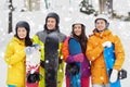 Happy friends in helmets with snowboards Royalty Free Stock Photo