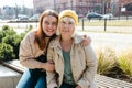 Happy friends holding each other. Happy loving older mature mother and grown millennial daughter laughing embracing Royalty Free Stock Photo