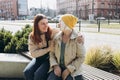 Happy friends holding each other. Happy loving older mature mother and grown millennial daughter laughing embracing Royalty Free Stock Photo