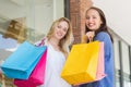 Happy friends holding shopping bags Royalty Free Stock Photo