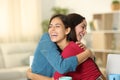 Happy friends are hugging at home Royalty Free Stock Photo