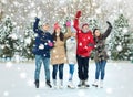 Happy friends ice skating on rink outdoors Royalty Free Stock Photo