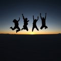 Happy friends jumping outdoor Royalty Free Stock Photo