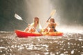 Happy friends kayak on the lake or river together during summer vacation. Free, freedom and rowing women canoeing on a