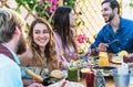 Happy friends lunching with healthy food in bar coffee brunch - Young people having fun eating meal and drinking fresh smoothies Royalty Free Stock Photo