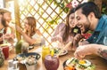 Happy friends lunching with healthy food in bar coffee brunch - Young people having meal eating and drinking smoothies Royalty Free Stock Photo