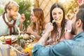 Happy friends lunching with healthy food in bar restaurant - Young people having brunch meal eating and drinking smoothies Royalty Free Stock Photo