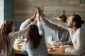 Happy friends meeting in cafe giving high five for friendship Royalty Free Stock Photo