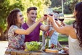 Happy friends in the park having lunch Royalty Free Stock Photo