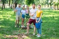happy friends planting new trees and volunteering Royalty Free Stock Photo