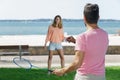 happy friends playing badminton at summer garden Royalty Free Stock Photo