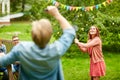 Happy friends playing badminton at summer garden Royalty Free Stock Photo