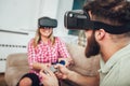 Happy friends playing video games with virtual reality glasses Royalty Free Stock Photo